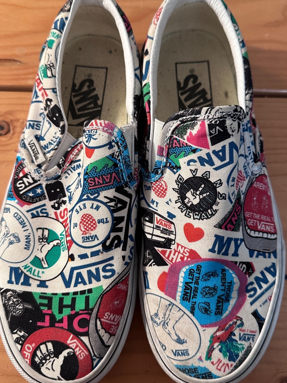 Vans Slip-On Sneakers with White, Blue, Green, Red, Pink, Black Graphic Print